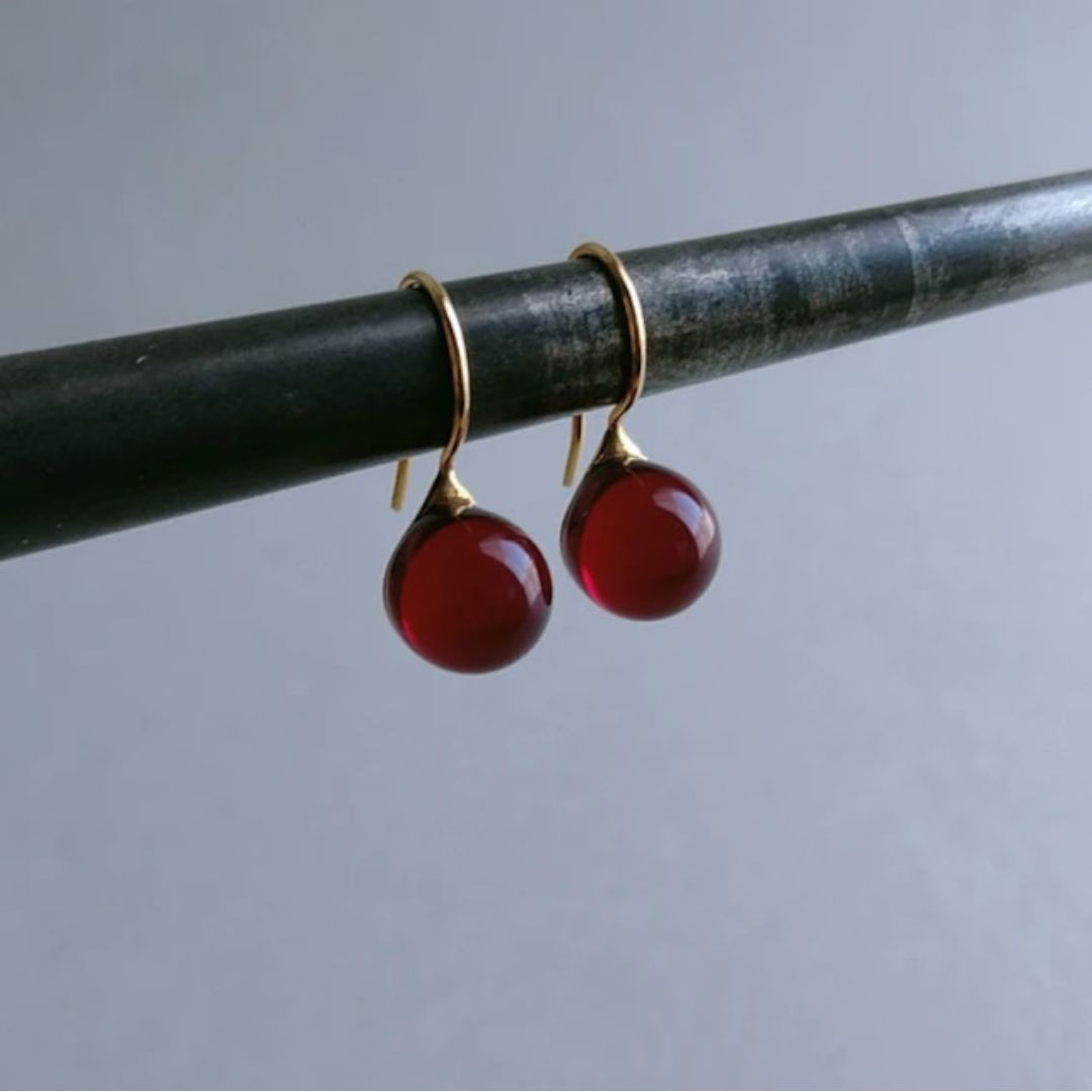 Handcrafted minimalist style round glass drop earrings in red color with 23K gold
