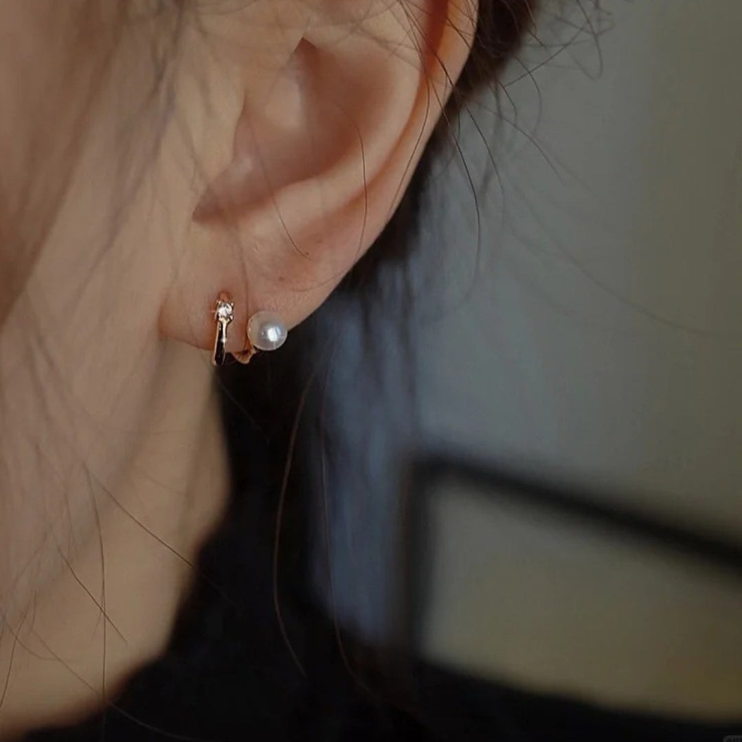 A dainty pearl wedding earrings with diamond.