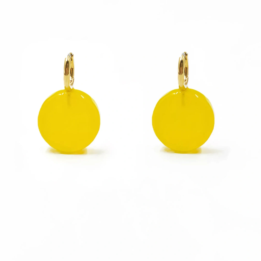 Front view of two identical bright yellow geometric glass earrings on a white background.