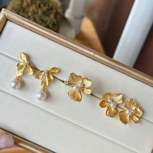 Close-up of Flower Statement Earrings featuring freshwater pearl statement earrings and three sparkling diamonds, perfect as bridal pearl statement earrings and Gold pearl earrings for a statement pearl earrings wedding look.