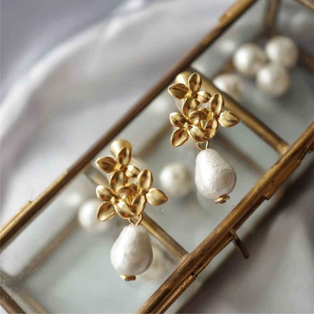 Pair of gold flower pearl earrings with teardrop pearls, ideal as wedding earrings or bridesmaid gift for a vintage-inspired look.