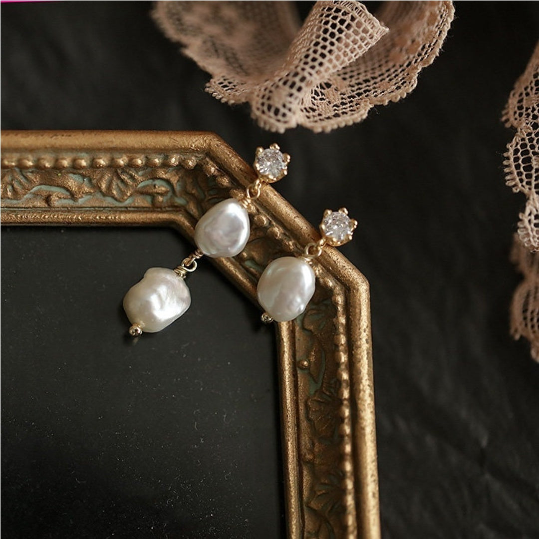 Asymmetric floating baroque freshwater pearl drop earrings showing long and short variations for a minimalist look - product-studio-1