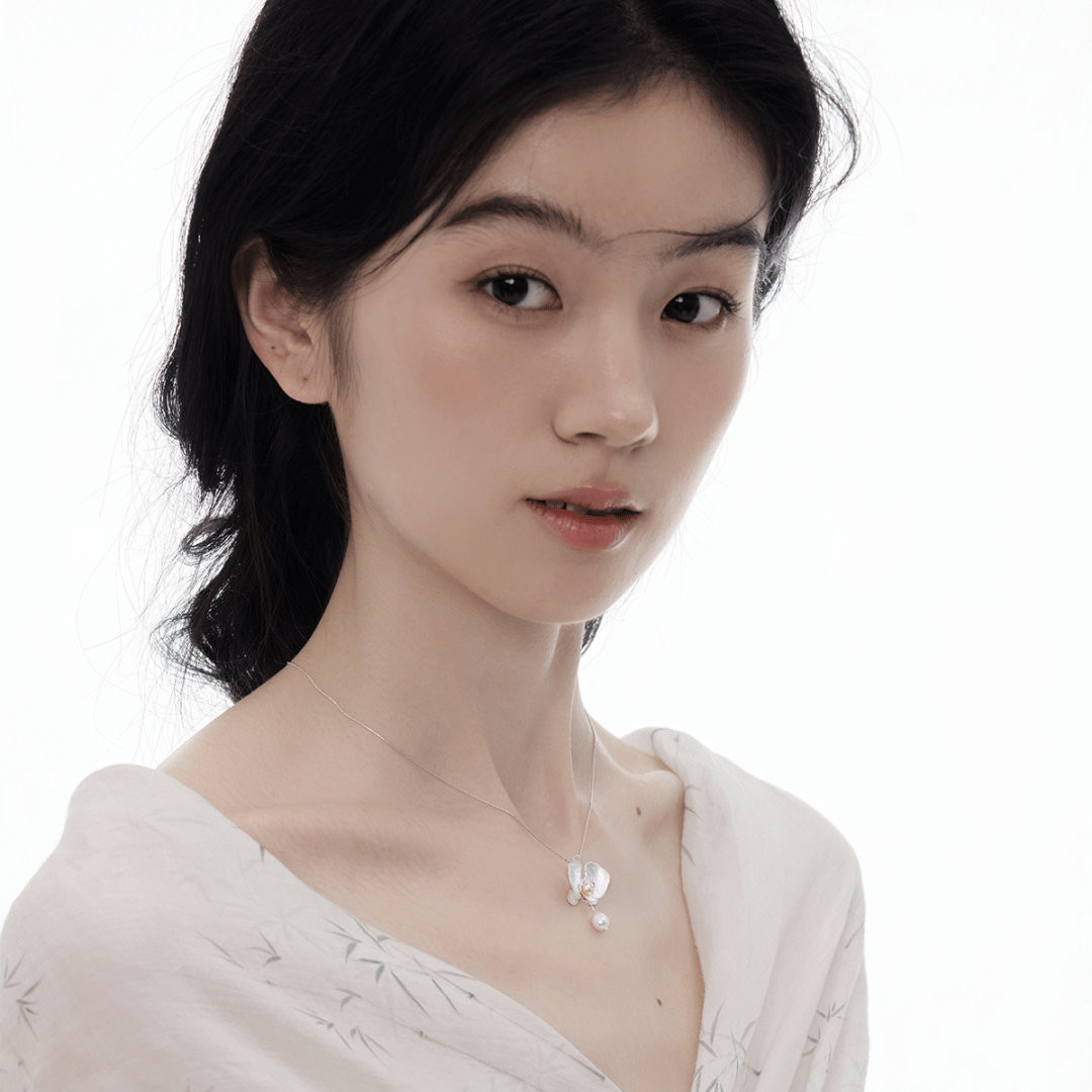 Botanical Realism Exquisite silver orchid earrings and necklace set for an elegant evening look.