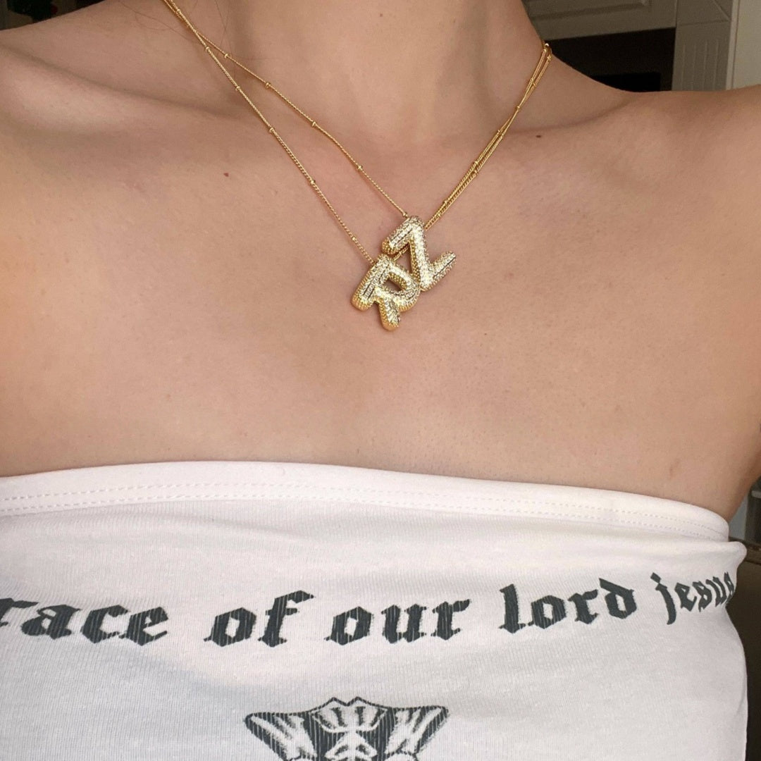 Layered puffy bubble letter necklaces for a personalized monogram style.2