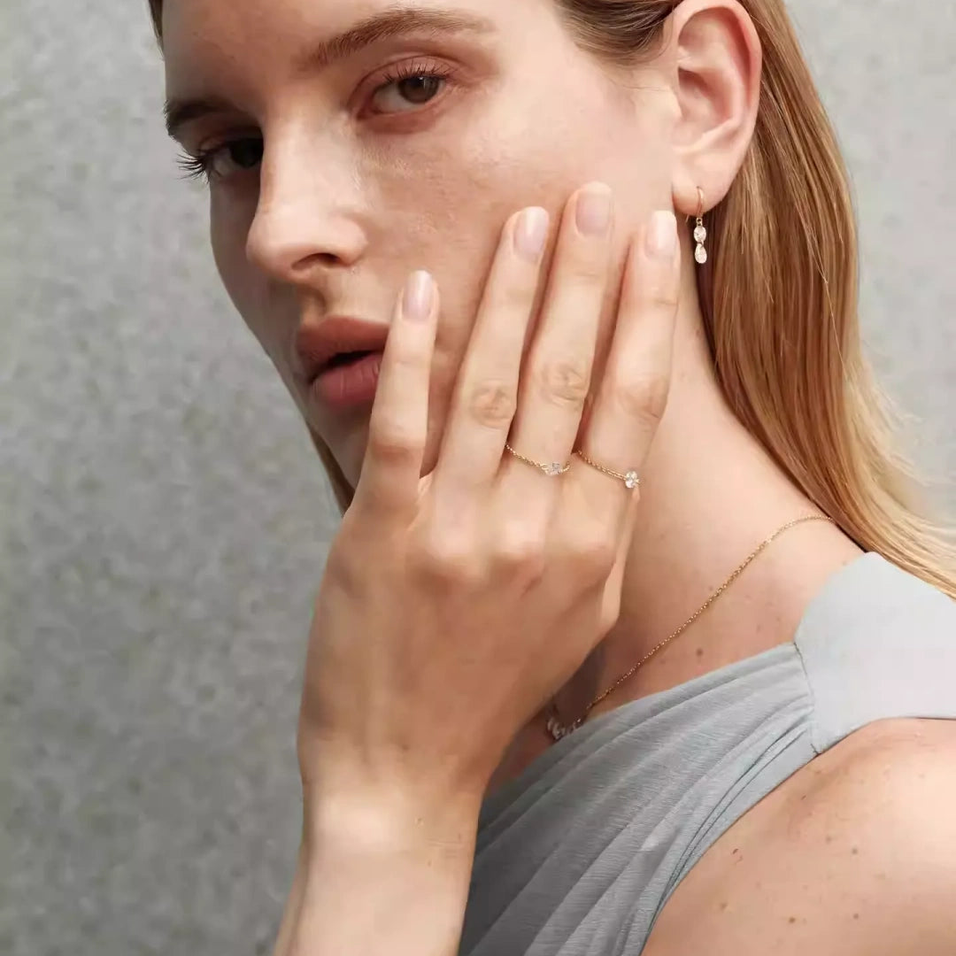 Bride wearing moissanite wedding jewelry set with smile necklace and shimmering pear drop earrings for an elegant bridal look. Model Images 3